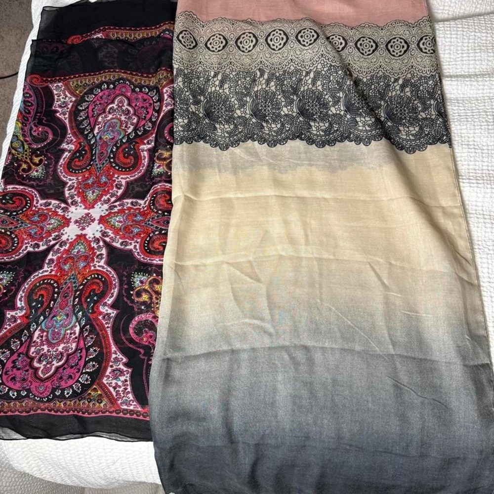 2 long flows scarfs with paisley design in red, pink, and purple on black